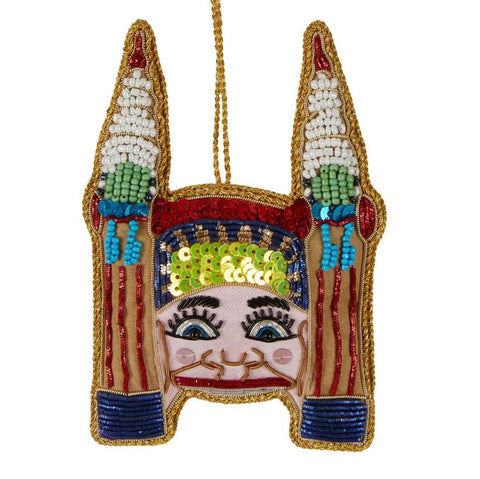 A sequin Christmas decoration adorned with sequins and small beads.