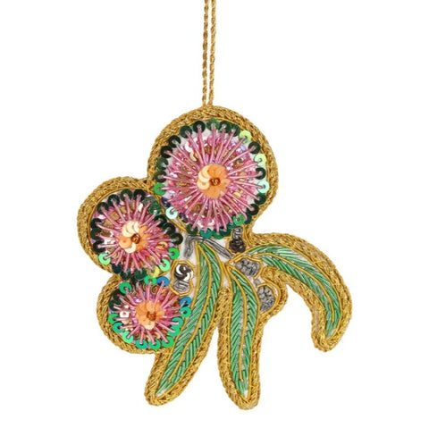 A sequined decoration resembling a flowering gum tree with pink, white, and green colors and gold accents, designed for Christmas tree trimming.